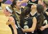Bentonville Gold players celebrate their win Saturday against Fort Smith’s Ramsey Junior High in the 7A-West Junior High volleyball regional tournament at Fayetteville High School.