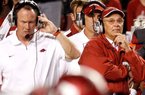 Arkansas Coach John L. Smith (right) said injuries that force players to miss time mean a team has to readjust and restart, something he said the Razorbacks have done.