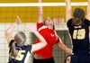 Rene Scheyder of Farmington tries to send a shot past Prairie Grove’s Megan Gerwig, left, and Caleigh Moyer during their semifinal match Oct. 16 during the 4A Northwest Conference tournament at Prairie Grove.