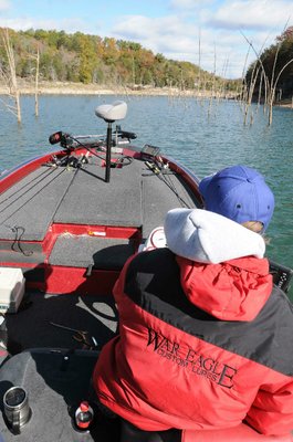 
                           Brashers idles out of a cove full of cover, headed to another fishing spot.