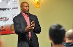 Arkansas defensive coordinator Paul Haynes, shown speaking to the Northwest Arkansas Touchdown Club on Wednesday, said the Razorbacks have not increased blitzing in their two-game winning streak, it just appears that way. Haynes said tighter coverage in the secondary is a contributing factor.