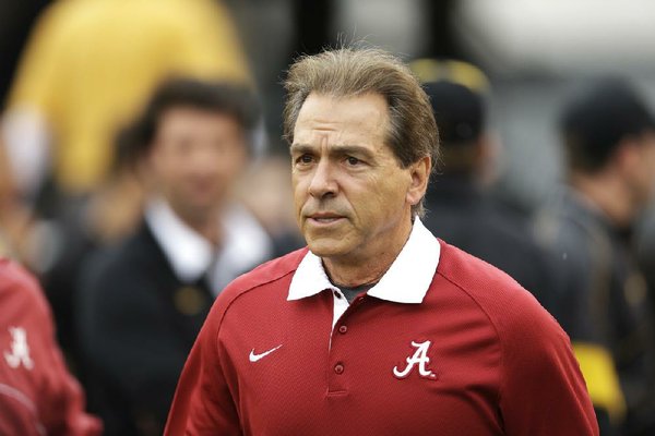 Alabama head coach Nick Saban roams the field before the start of an NCAA college football game between Missouri and Alabama Saturday, Oct. 13, 2012, in Columbia, Mo. (AP Photo/Jeff Roberson)