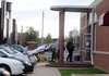 A patient is removed from the Springdale High School ninth-grade ALE building Friday morning.