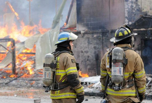 
                               
                                  Photo by Samantha Baker&mdash;
                               
                           
                           David Williams, left, with Siloam Springs Fire Department and Tyler Phelan with Rogers Fire Department watch as Lakeside Restaurant burns Friday, Oct. 26, 2012, at Lake Atalanta in Rogers during a training exercise for the Rogers Fire Department and their Rookie Training Academy.