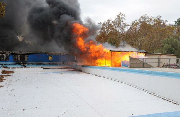 
                               
                                  Photo by Samantha Baker&mdash;
                               
                           
                           STAFF PHOTO SAMANTHA BAKER
Firefighters burn Lakeside Restaurant Friday, Oct. 26, 2012, at Lake Atalanta in Rogers during a training exercise for the Rogers Fire Department and their Rookie Training Academy.