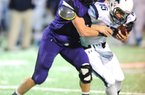 STAFF PHOTO ANDY SHUPE
Fayetteville senior linebacker Brooks Ellis, left, hits Har-Ber senior quarterback Pierce Phillips Friday, Oct. 26, 2012, during the first half against Har-Ber at Harmon Stadium.