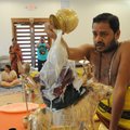 Sri Swami Venugopalla Gattu pours milk over a statue of the goddess Durga during a ceremony at the D...