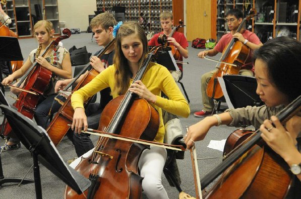 
                           Notes from the cello section ring true during a Bentonville High School orchestra practice.