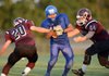 Samuel Xiong, right, a Decatur running back is chased down by Gentry’s Dustin Soufflet, left, and Dalton Morris during their scrimmage Aug. 23 in Gentry.