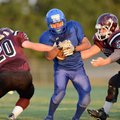 Samuel Xiong, right, a Decatur running back is chased down by Gentry’s Dustin Soufflet, left, and Da...