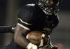STAFF PHOTO MARC F. HENNING -- Bentonville running back Tearris Wallace celebrates after scoring his first of four touchdowns of the night during the Tigers' game Friday, Sept. 14, 2012, against South Panola (Miss.) at Tiger Stadium in Bentonville.