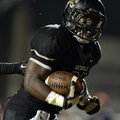 STAFF PHOTO MARC F. HENNING -- Bentonville running back Tearris Wallace celebrates after scoring his...