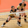 Hailey McNee, left, of Bentonville digs a ball hit by North Little Rock on Wednesday as Sabrina Shep...