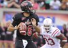 ASU Quarterback Ryan Aplin looks to pass during the 1st quarter against Western Kentucky Saturday night at ASU stadium in Jonesboro.