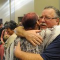 Frank Manasseri of Pea Ridge gets congratulations Thursday from Dianna Portillo, veterans coordinato...