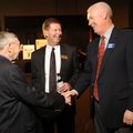 Donny Story, right, president and chief executive officer for Arvest Bank in Fayetteville, speaks Th...