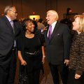 Merlin Augustine, left, and his wife, Beverly, share a laugh Thursday with Steve Clark, president an...