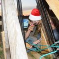 Hannah Lueders, 14, loads a pumpkin into the catapult she built with classmates Cecile Bowen and Ann...