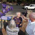 Longtime Eureka Springs artist Zeek Taylor, center, is greeted Oct. 4 by friends and patrons Cheryl ...