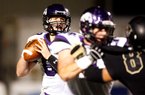 Fayetteville quarterback Austin Allen looks for a receiver in the first half of a 24-17 loss to top ranked Bentonville on Friday at Tiger Stadium in Bentonville. Allen threw for 194 yards.