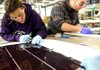 Employees at the Xunlight Corp. factory in Toledo, Ohio, work on a solar panel in September. Orders for manufactured goods rose 4.8 percent in September, the Commerce Department said Friday. 
