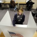 Grace Mayes, a freshman at Ramay Junior High School, votes Friday during a mock election held by the...