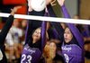 Cassidy Ginger, left, Fayetteville junior, and Mikayla Avery, senior, attempt to block a Bentonville shot Thursday during their Class 7A state tournament semifinal match at Rogers Heritage High School. 