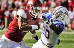 Arkansas wide receiver Julian Horton (2) tries to get around Tulsa defensive back Marco Nelson (20) during the first quarter of an NCAA college football game in Fayetteville, Ark., Saturday, Nov. 3, 2012. (AP Photo/April L. Brown)