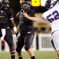 Reese Dollins, Bentonville senior quarterback, passes Friday against Fayetteville at Tiger Stadium i...