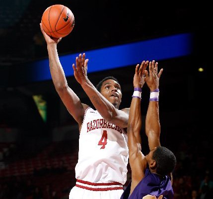 NWA Media/JASON IVESTER -- Arkansas junior Coty Clarke attempts a hook shot over LeMoyne-Owen junior Victor Shell during the first half on Monday, Nov. 5, 2012, at Bud Walton Arena in Fayetteville.