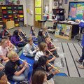 Carlena Lambert works with music students Friday afternoon at Asbell Elementary School in Fayettevil...