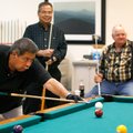 Alex Simon of Springdale and Gene McClure of Rogers, right, watch as Al Poolaw, left, of Rogers, lin...