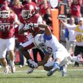 Cobi Hamilton, University of Arkansas receiver, is taken down at the one-yard line to set up an Arka...