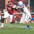 NWA Media/ MICHAEL WOODS - Arkansas receiver Cobi Hamilton tries to fend off Tulsa defender Mitchell...