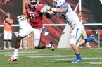 NWA Media/ MICHAEL WOODS - Arkansas receiver Cobi Hamilton tries to fend off Tulsa defender Mitchell Osborne as he runs for a big gain in the third quarter of a Nov. 3, 2012 game at Donald W. Reynolds Razorback Stadium. 