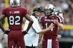 South Carolina coach Steve Spurrier talks to quarterback Connor Shaw asD. L. Moore looks on during the first half of an NCAA college football game against Tennessee, Saturday, Oct. 27, 2012, at Williams-Brice Stadium in Columbia, S.C.(AP Photo/Richard Shiro)