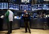 Traders work on the floor of the New York Stock Exchange on Tuesday. 
