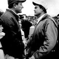 Arkansas football coach Frank Broyles, left, and Texas coach Darrell Royal greet on the field in Fay...