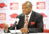 NWA Media/ANDY SHUPE
Arkansas coach Mike Anderson speaks to members of the media Thursday, Oct. 11, 2012, with guard Kikko Haydar, left, as they sit for a team photo during Media Day at Bud Walton Arena in Fayetteville.