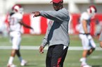 University of Arkansas coach Paul Haynes works with the defense during practice Tuesday afternoon in Fayetteville.