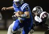 Nick Wary, Rogers High quarterback, carries the ball on a keeper play Oct. 26 during the game against Siloam Springs at Mountie Stadium in Rogers
