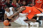 NWA MEDIA/SAMANTHA BAKER -- Arkansas' Marshawn Powell (left) and Jeremy McKay from Sam Houston State dive for the ball during the second half of the men's season opener Friday, Nov. 9, 2012, at Bud Walton Arena in Fayetteville.