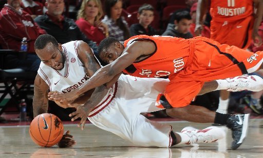 nwa-mediasamantha-baker-arkansas-marshawn-powell-left-and-jeremy-mckay-from-sam-houston-state-dive-for-the-ball-during-the-second-half-of-the-mens-season-opener-friday-nov-9-2012-at-bud-walton-arena-in-fayetteville