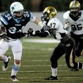 Springdale Har-Ber senior running back Tucker Lee (34) stiff arms Little Rock Central junior Nate Mc...