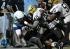 Little Rock Central’s Antonio Igbokidi (40) and Daryl Coburn (50) bring down Springdale Har-Ber’s Tucker Lee during Friday night’s game. 