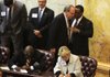 State House speaker-designee Darrin Williams (right), D-Little Rock, confers with Rep. Terry Rice, R-Waldron, the man Republicans want to be the new speaker, as other House members draw numbers by lot to determine seating arrangements. 