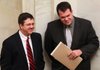 Sen. Larry Teague (left), DNashville, talks with new state Senate Pro Tempore Michael Lamoureux, R-Russellville, in the Senate chamber Thursday. Teague will be co-chairman of the joint Budget Committee. 
