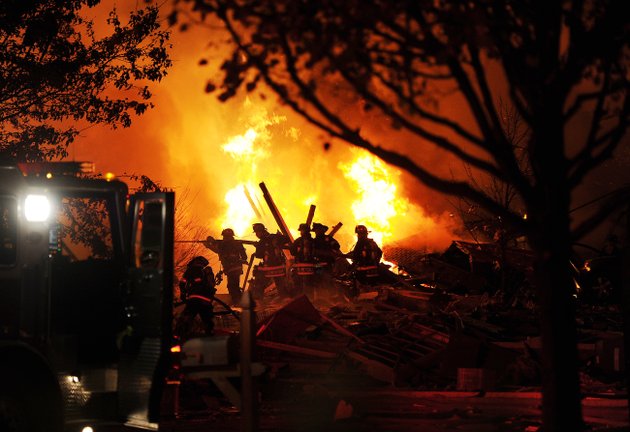firefighters-work-the-scene-where-an-explosion-has-killed-two-people-and-damaged-more-than-a-dozen-homes-in-the-richmond-hill-subdivision-late-saturday-nov-10-2012-in-indianapolis