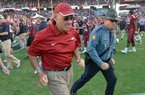 NWA Media/ MICHAEL WOODS --11/10/2012-- John L Smith runs off the field following Arkansas' 38-20 loss to South Carolina on Saturday at Williams-Brice Stadium. 