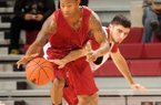 NWA Media/ANTHONY REYES -- Kikko Haydar (20) reaches in on red team's DeQuavious Wagner (23) during the first half of a scrimmage Tuesday, Oct. 30, 2012 at Bud Walton Arena in Fayetteville. 